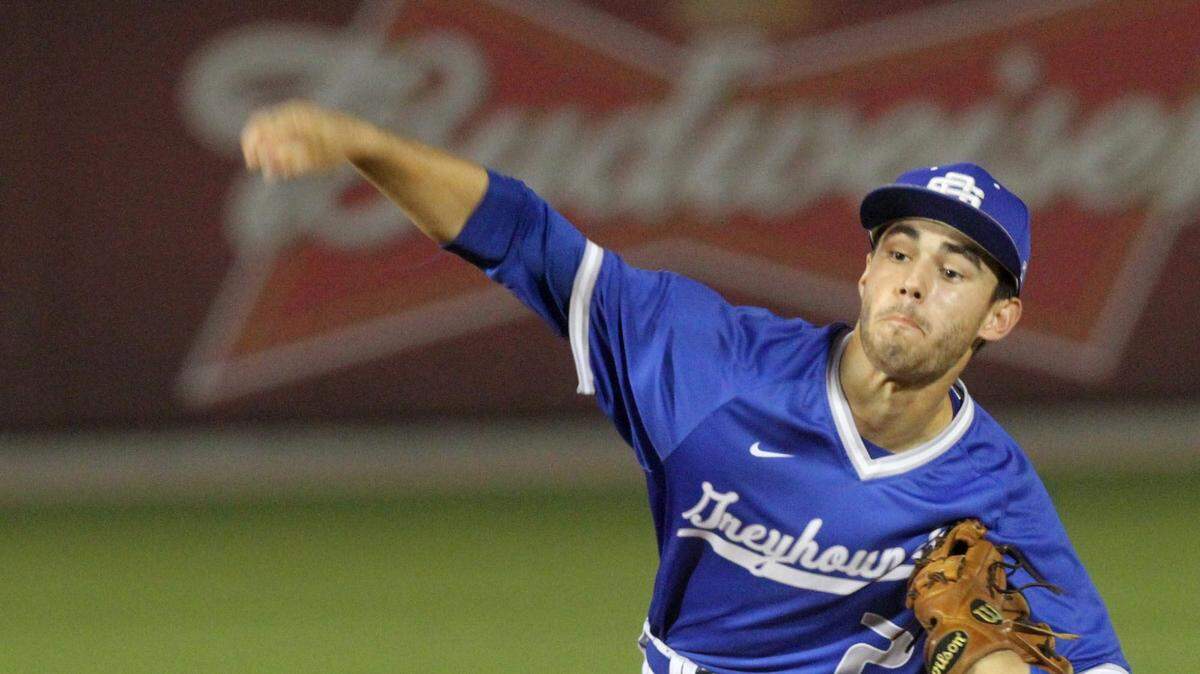 JOHN FITZHUGH/SUN HERALD 
 Ocean Springs pitcher Cooper Brune throws against Gulfport during the first inning of their game at MGM Park in Biloxi on Thursday March 17, 2016.