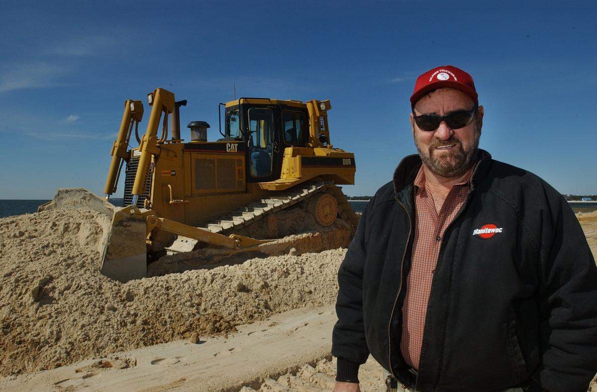 Gulfport contractor W.C. "Cotton" Fore is pictured with a bulldozer in 2002 as his company, W.C. Fore Trucking Inc., assists with expansion at the state Port of Gulfport.