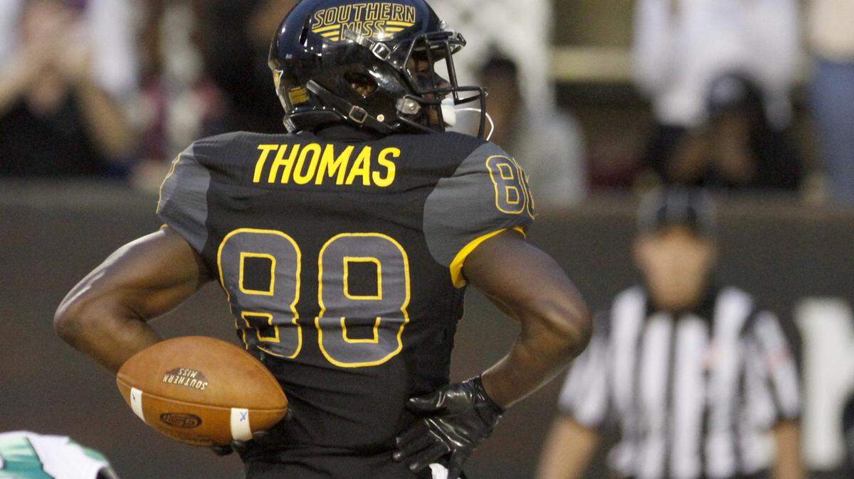 TIM ISBELL/SUN HERALD 
 Southern Miss receiver Mike Thomas strikes a pose after catching a touchdown pass against North Texas Saturday in Hattiesburg.