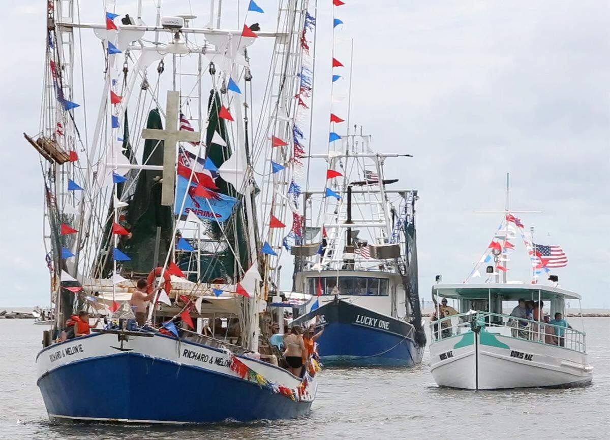 JOHN FITZHUGH/SUN HERALDBoats come down the Biloxi Channel on Sunday June 5, 2016 for the 2016 Biloxi Blessing of the Fleet.