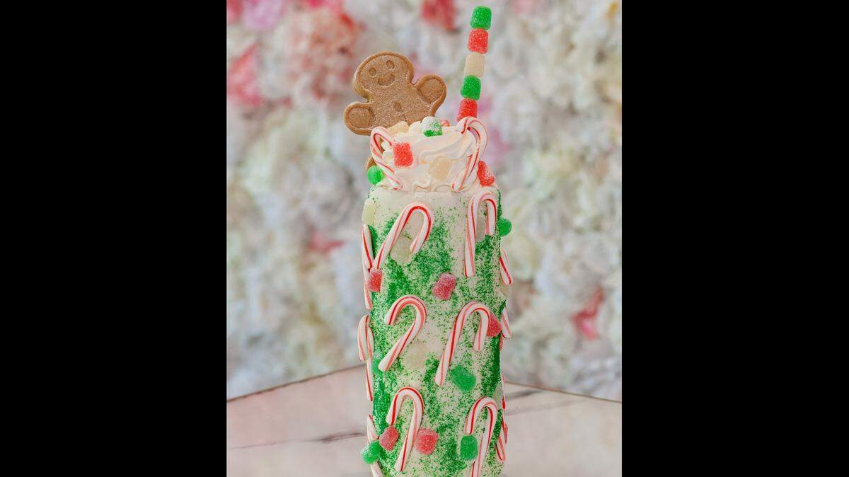 ‘Tis The Season Insane Milkshake at Sugar Factory inside Hard Rock Casino Biloxi is served in a white-chocolate-dipped mug and is decorated with mini candy canes and gumdrops and topped with a gingerbread man for a holiday treat.