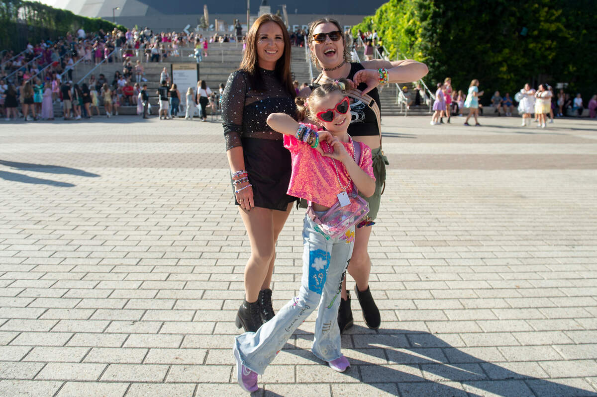 Fans show off their outfits outside the Cesars Superdome in New Orleans on Friday, Oct. 25, 2024, before Taylor Swift’s Eras Tour performance that night.