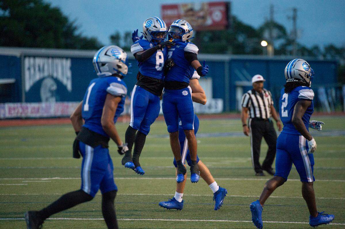 Ocean Springs’ Bryhsen Smith and Will Smith Jr. celebrate after a touchdown during a game against Madison Central at Greyhound Stadium in Ocean Springs on Friday, Aug. 30, 2024.
