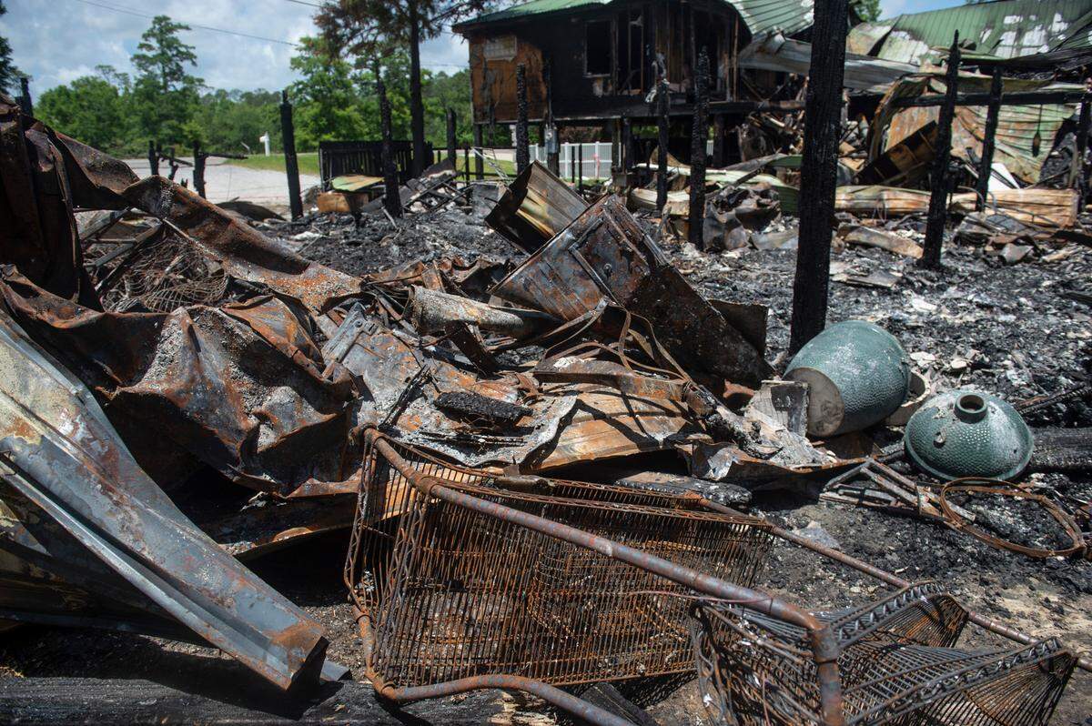 A green egg smoker and twisted metal are some of the few things remaining on Tuesday, May 31, 2022 after a fire tore through the house and the house next-door on Saturday night, killing two.