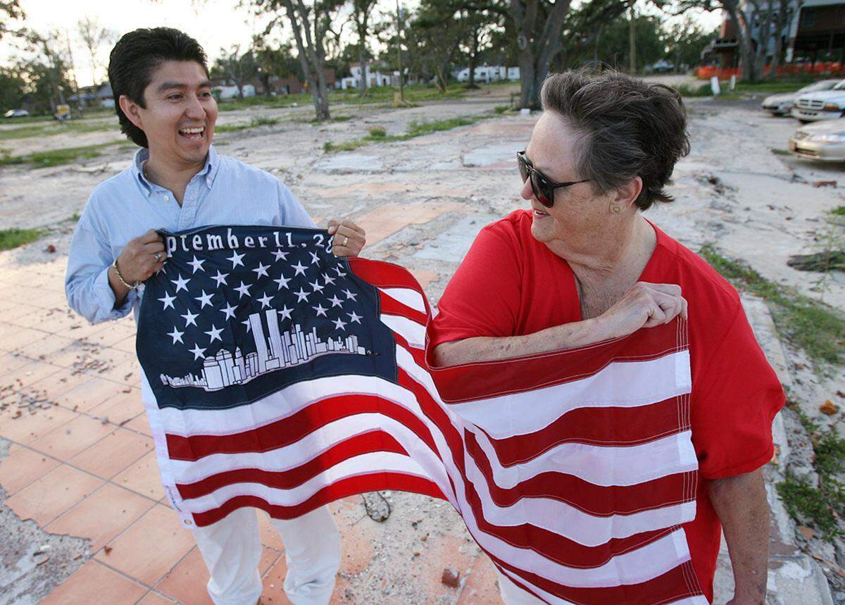 El Maguey Mexican restaurant customer Pat Hill found this American flag to replace the one lost by restaurant manager Mercedes Carranza when the restaurant was destroyed in Hurricane Katrina.