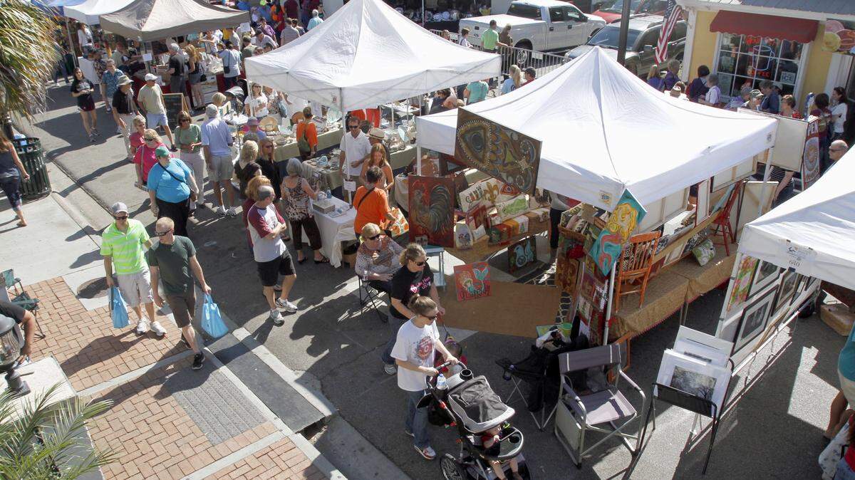 Shoppers make their way down Government Street and other areas of downtown Ocean Springs for the Peter Anderson Festival, which returns this weekend.