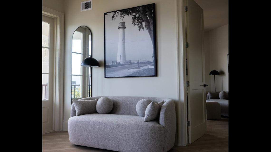 A photo of the Biloxi Lighthouse and a comfortable couch for reading add relaxing touches to the guest rooms at the new expansion of the White House Hotel on the beach in Biloxi. It’s open in time for Cruisin’ The Coast antique and classic car show.