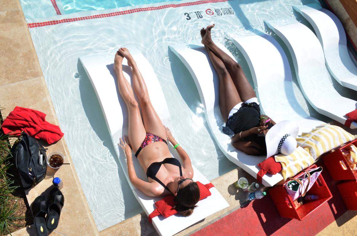 Customers soak in the sun at the H20 Pool and Bar at Golden Nugget Casino Biloxi. Some of the Coast casinos allow public access to their pools, the swim up bars and restaurants.