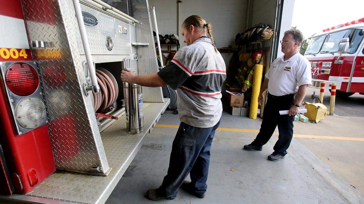 Mechanic Christopher Bellais, left, and Biloxi Fire Department Deputy Fire Chief John Jennings look over a spare Biloxi Fire Department pumper truck on Monday, seeing what items need replacing or cleaned. The Biloxi Fire Department is getting the truck cleaned up in hopes to donate it to the Three Forks Volunteer Fire Department.