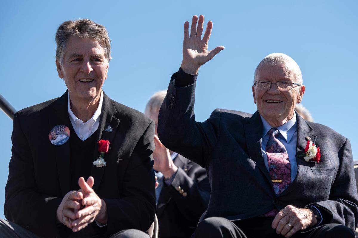 Biloxian and Apollo 13 astronaut Fred Haise Jr., right, and Biloxi Mayor Andrew “FoFo” Gilich wave to the crowd during a ceremony dedicating a statue in Haises’s honor at Biloxi Beach in Biloxi on Sunday, Feb. 13, 2022.