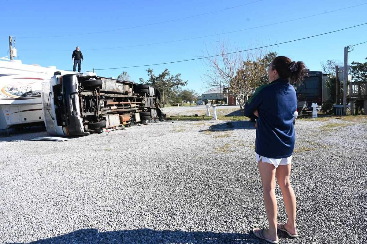 A Gulfport woman examines the damage at Gulf Haven Campground in Mississippi. Hurricane Zeta tore through the Gulf Coast overnight on Oct. 28, 2020.