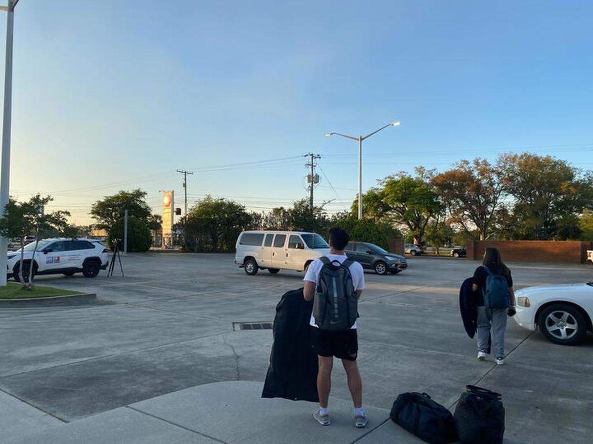 Students involved in a bus crash Friday on Interstate 10 in Hancock County waited for rideshare services to New Orleans at the Municipal Court in Bay St. Louis.