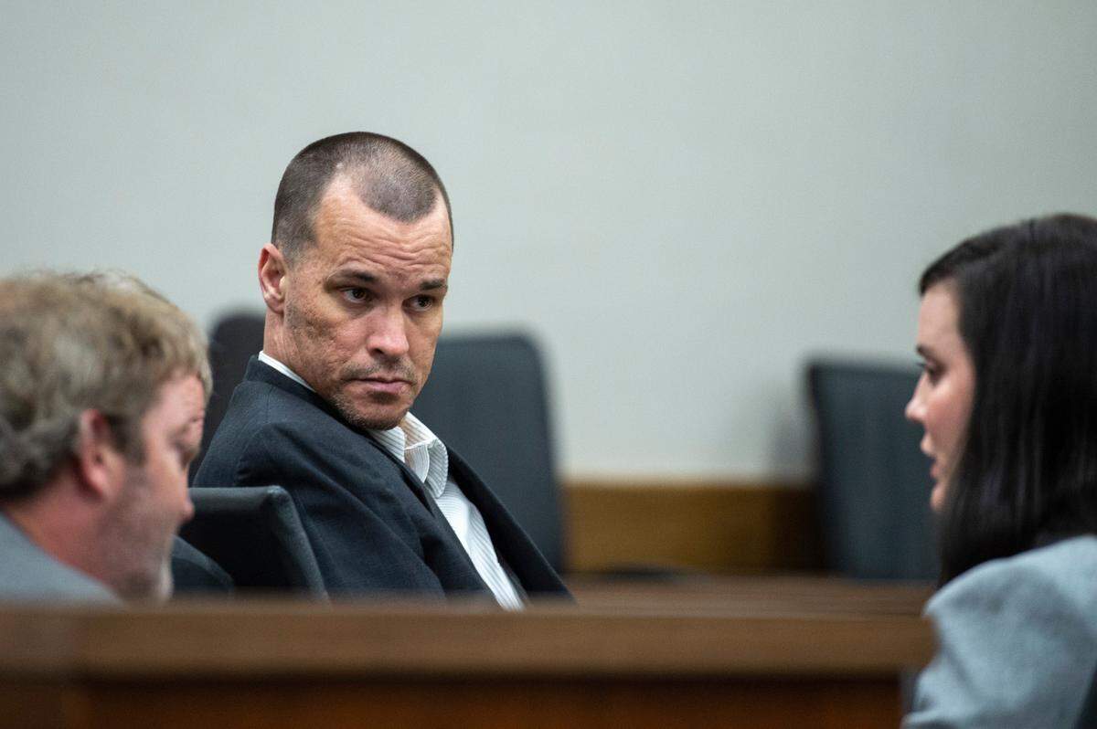 Gary Wayne Wallace, who is accused of killing his girlfriend Penny Clark, speaks with his lawyers during trial at Harrison County Circuit Court in Biloxi on Tuesday, March 8, 2022.