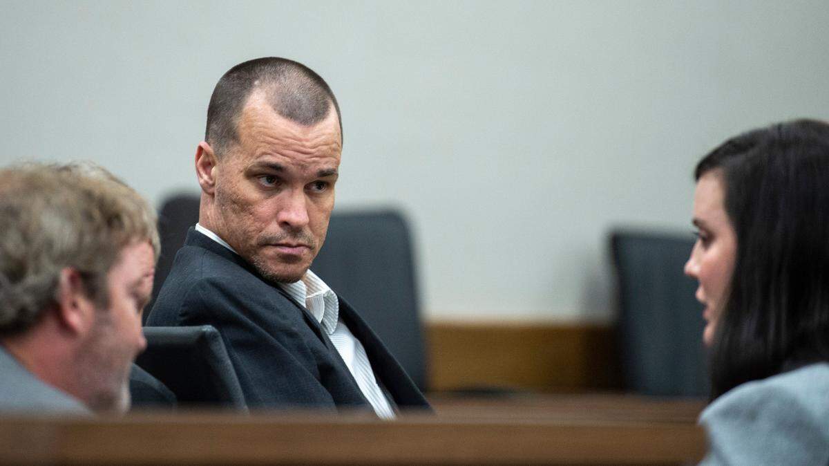 Gary Wayne Wallace, who is accused of killing his girlfriend Penny Clark, speaks with his lawyers during trial at Harrison County Circuit Court in Biloxi on Tuesday, March 8, 2022.