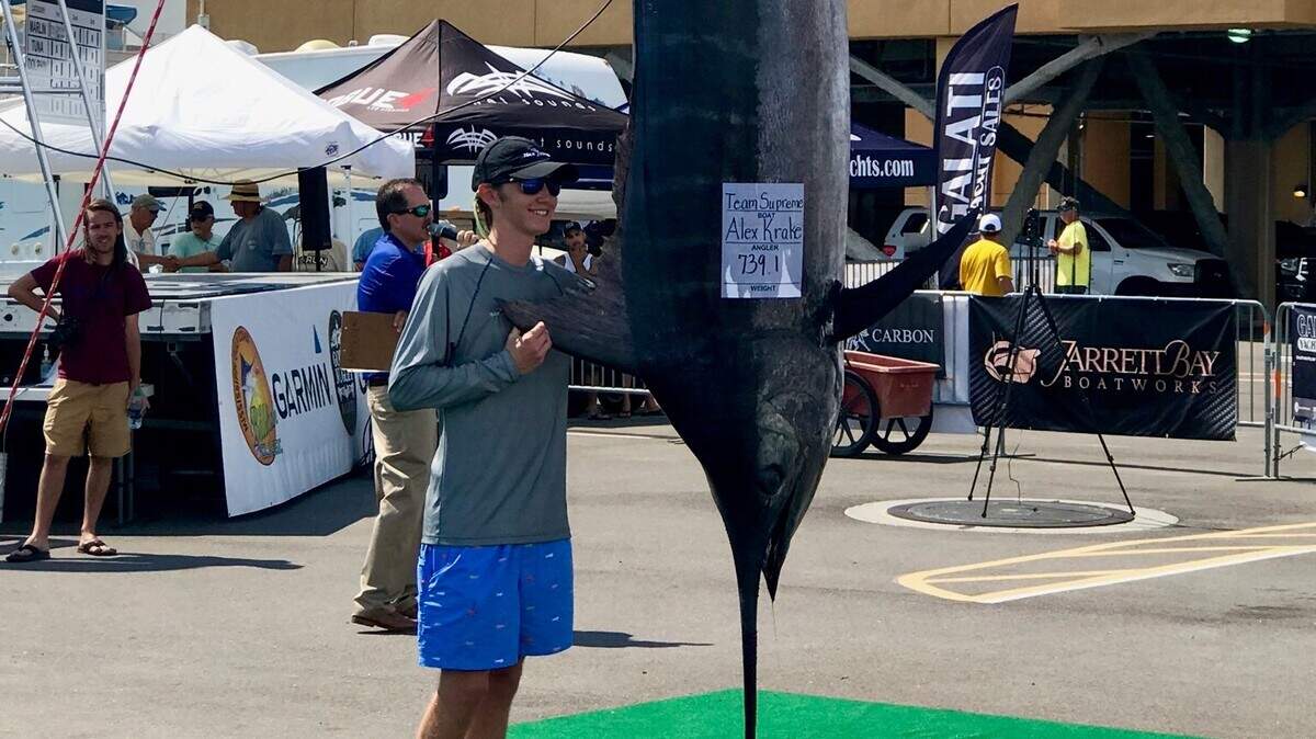 Alex Krake, 17, fishing aboard Team Supreme, fought a 739.1-pound marlin for 11 hours.  He has the top blue marlin heading into the second day of competition.