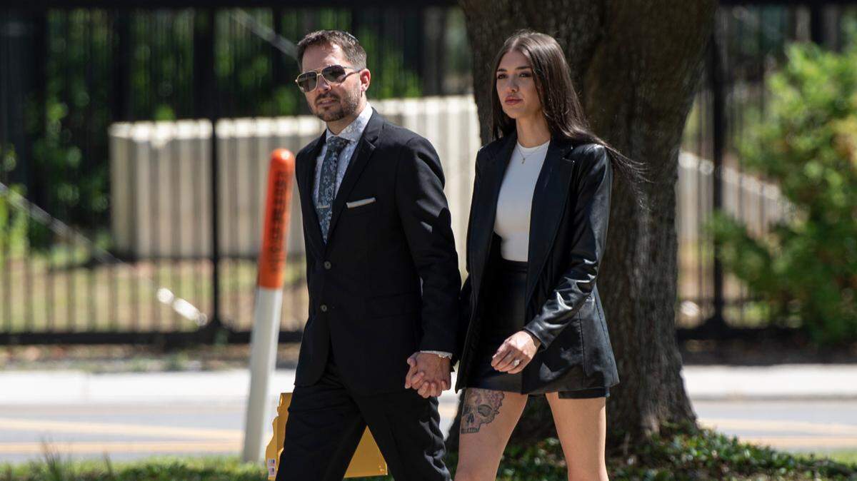 Robert Deming III and his girlfriend arrive at the Dan M. Russell Jr. Federal Courthouse in Gulfport on Wednesday, May 1, 2024, for Deming to plead guilty to selling products containing synthetic cannabinoids at his Candy Shop kratom stores.