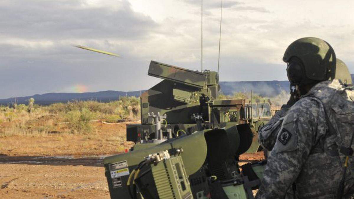STAFF SGT. SHANE HAMMAN 
 
 Soldiers with the 1st Battalion, 204th Air Defense Artillery Regiment of the Mississippi Army National Guard, emerge after a storm to prepare to fire a Stinger ground-to-air missile from an Avenger vehicle platform during a pre-deployment live-fire exercise on Fort Bliss, Texas.