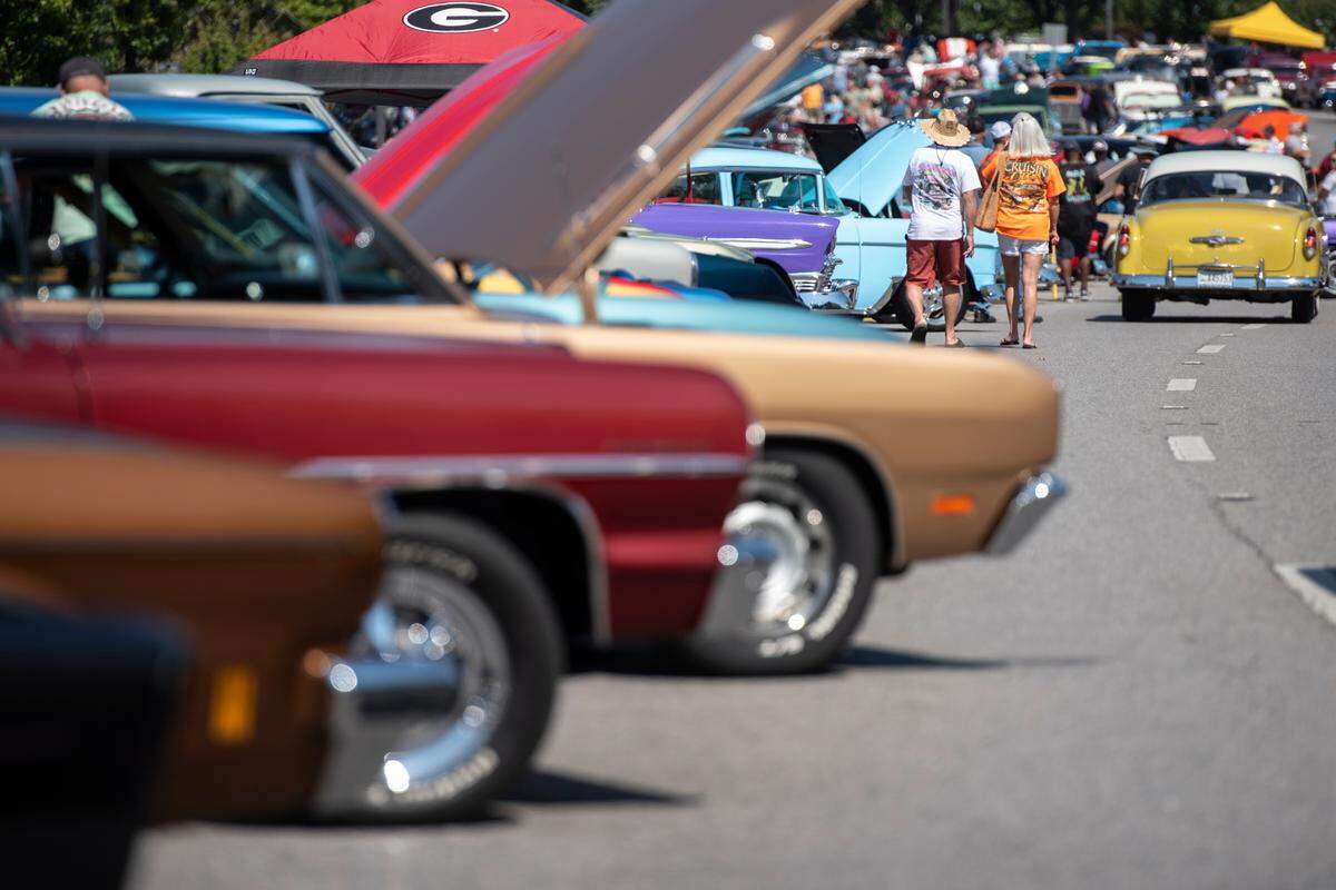 Spectators walk around downtown Moss Point during Cruisin’ The River City, a Cruisin’ The Coast event on Tuesday, Oct. 8, 2024.