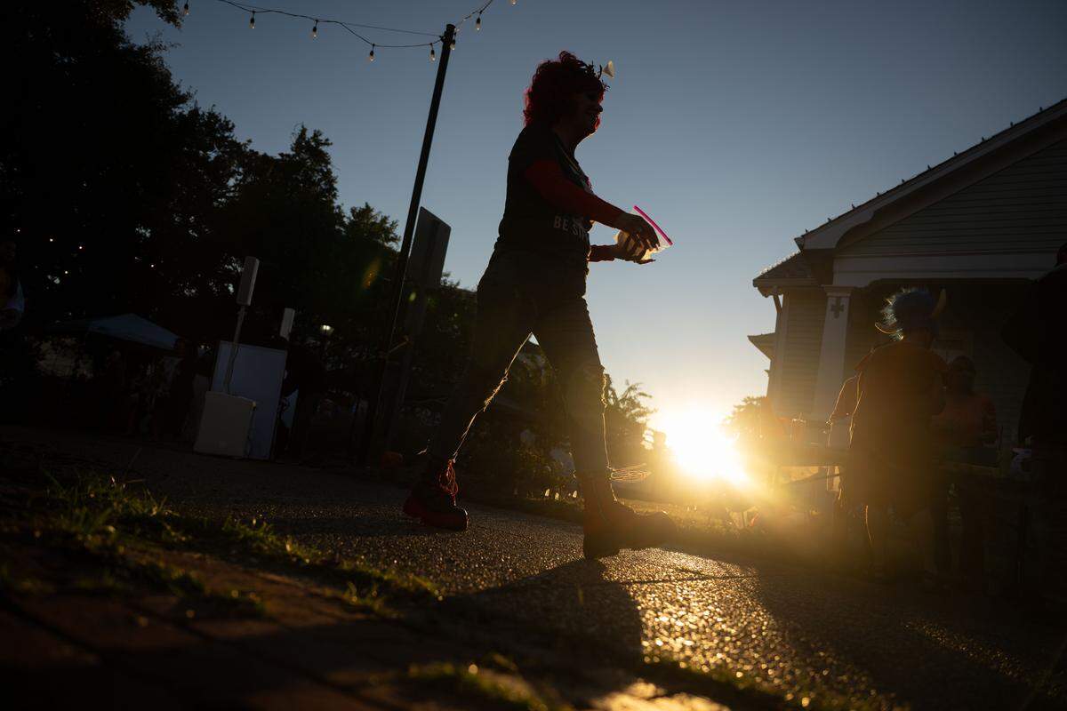 Event attendees walk down Rue Magnolia during Boo On The Rue in Biloxi on Thursday, October 30, 2025.