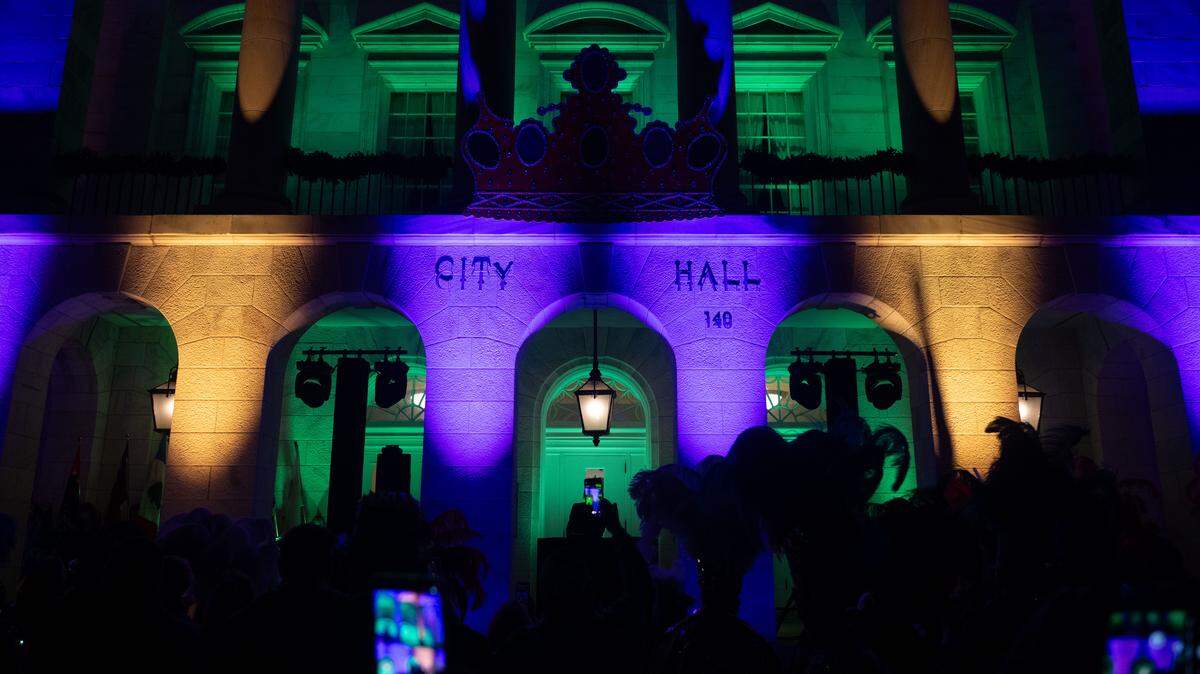 The lights of City Hall change from Christmas colors to Mardi Gras colors during a 12th Night Celebration in Biloxi on Monday, Jan. 5, 2026.