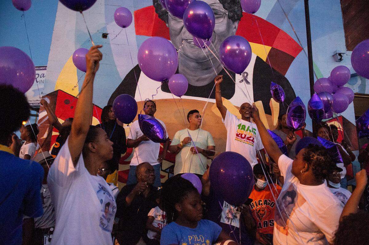 Family and friends of Inez Thomas who gathered outside her restaurant to remember her prepare to let go of purple balloons in her honor in East Biloxi on Friday, Oct. 22, 2021.