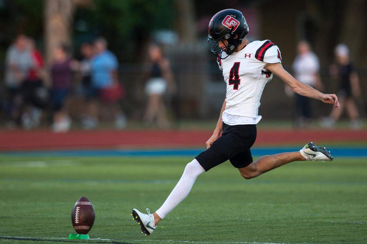 St. Stanislaus’s Evan Noel kicks a punt return during a game at Bay High in Bay St. Louis on Friday, Sept. 1, 2023.