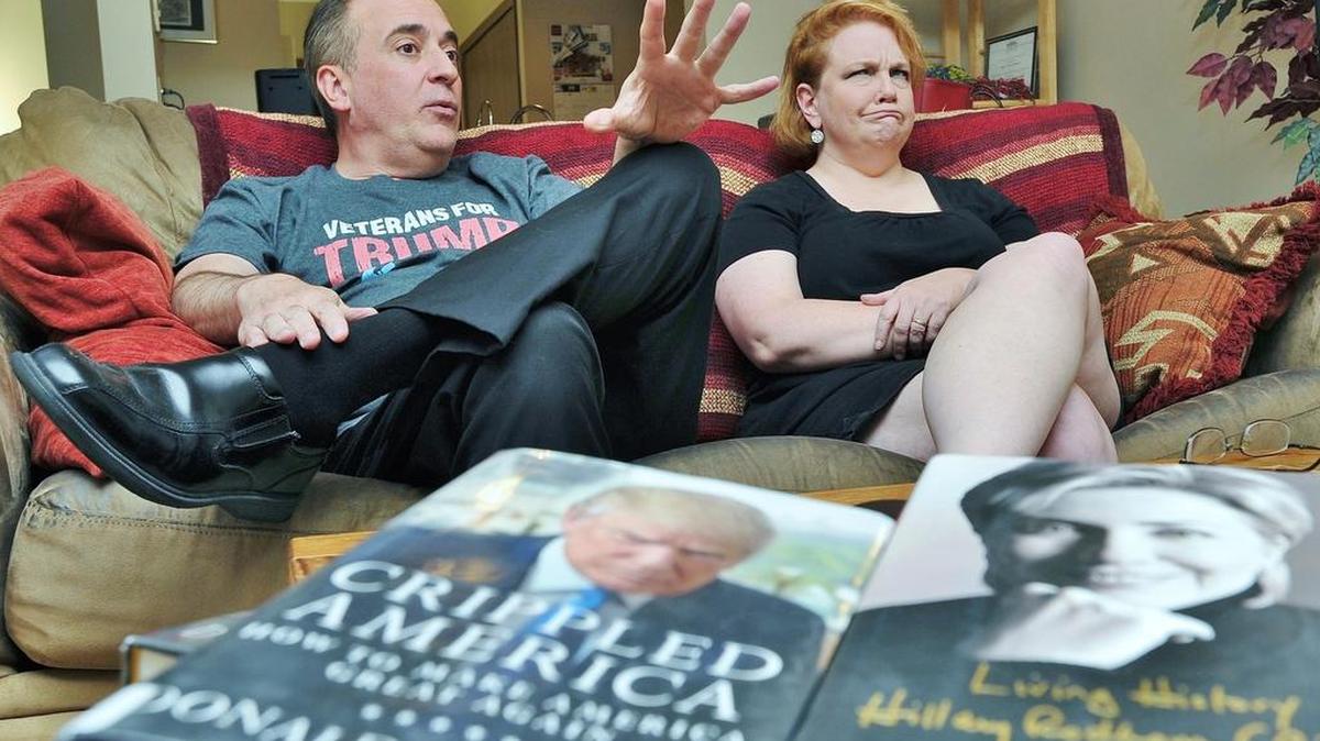 John Semilia, left, a Donald Trump supporter, and his wife, Lisa Craig, a supporter of Hillary Clinton, speak about their political differences during an interview at their home July 13, 2016 in Stow, Ohio.