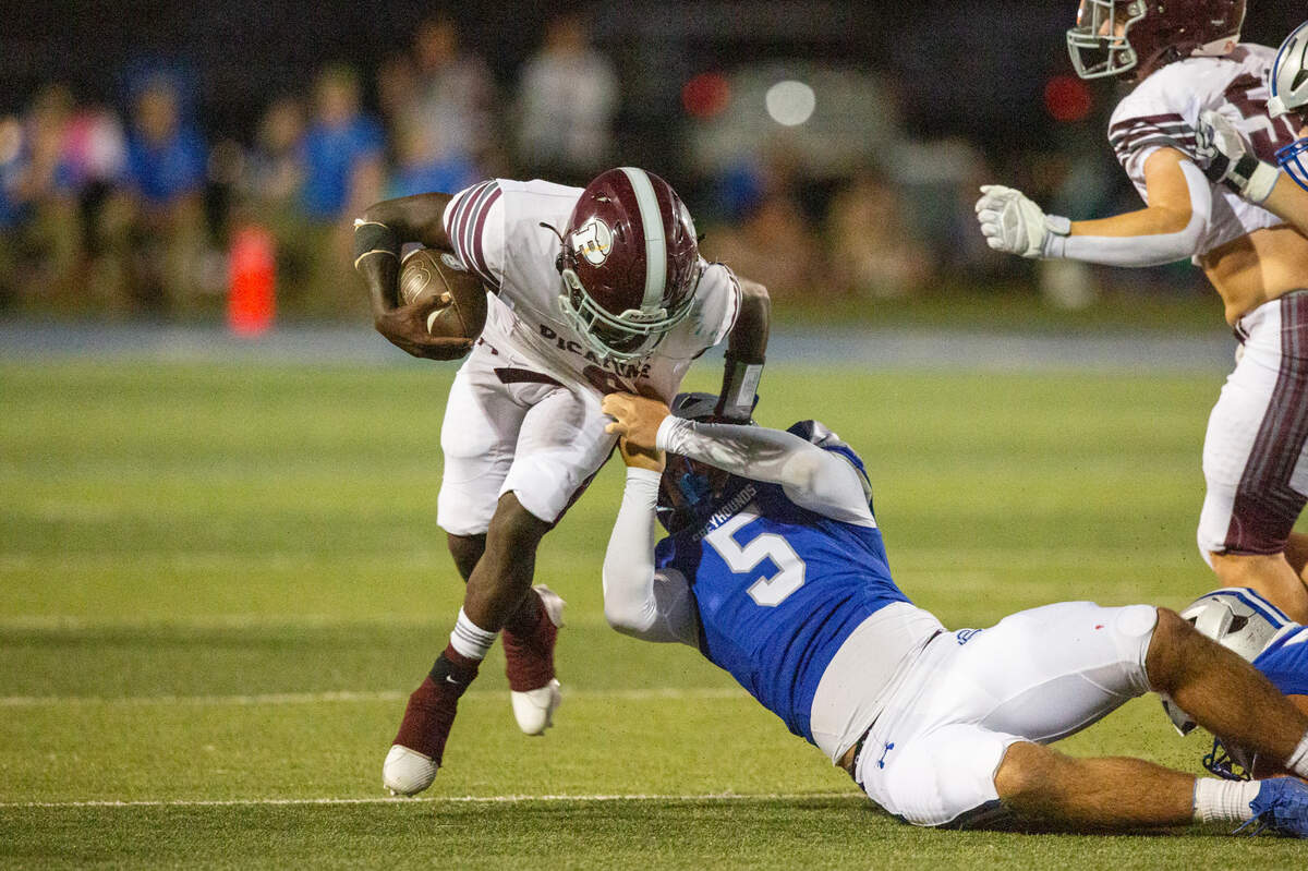 Picayune’s Brandon Parker runs the ball during a game between Picayune and Ocean Springs at Greyhound Stadium in Ocean Springs on Friday, Sept. 27, 2024.