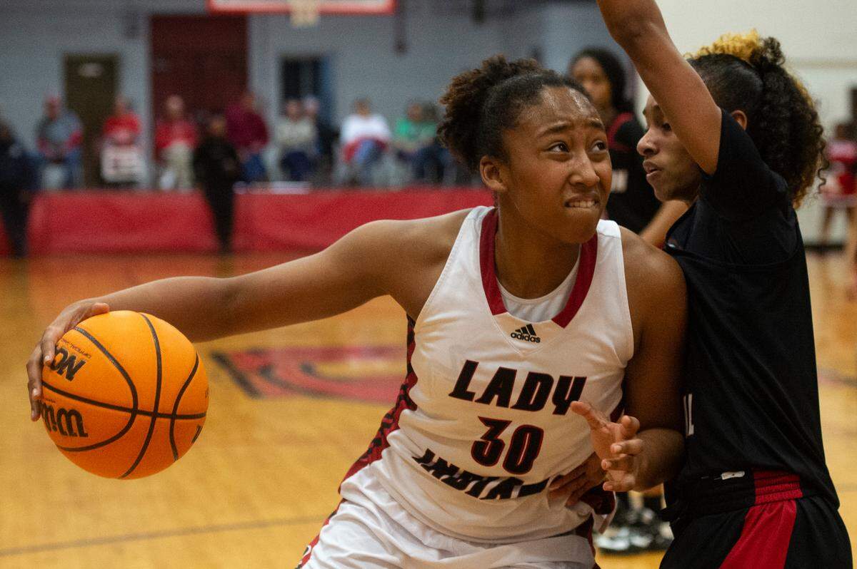Biloxi’s Shaneal Corpuz goes to the basket during the district title game at Harrison Central High School in Gulfport on Friday, Feb. 10, 2023.