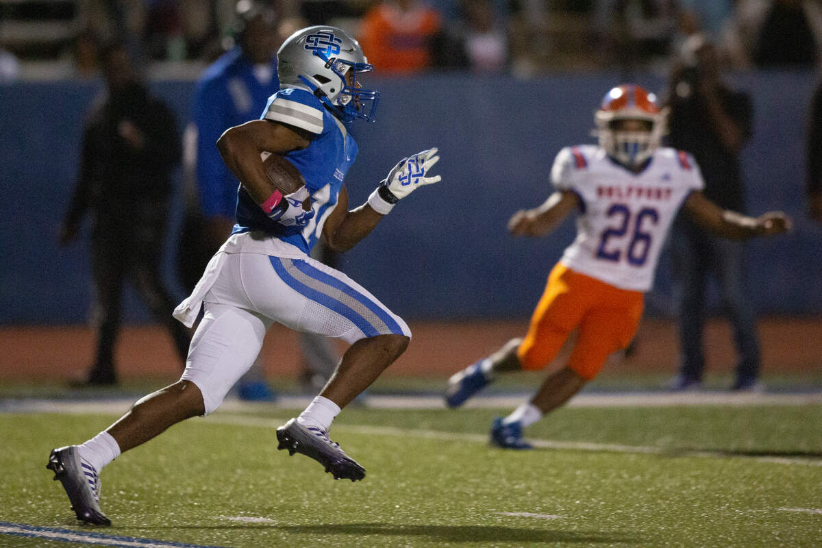 Ocean Springs’ John Paul Coulter runs the ball during a game against Gulfport at Greyhound Stadium in Ocean Springs on Friday, Oct. 28, 2022.