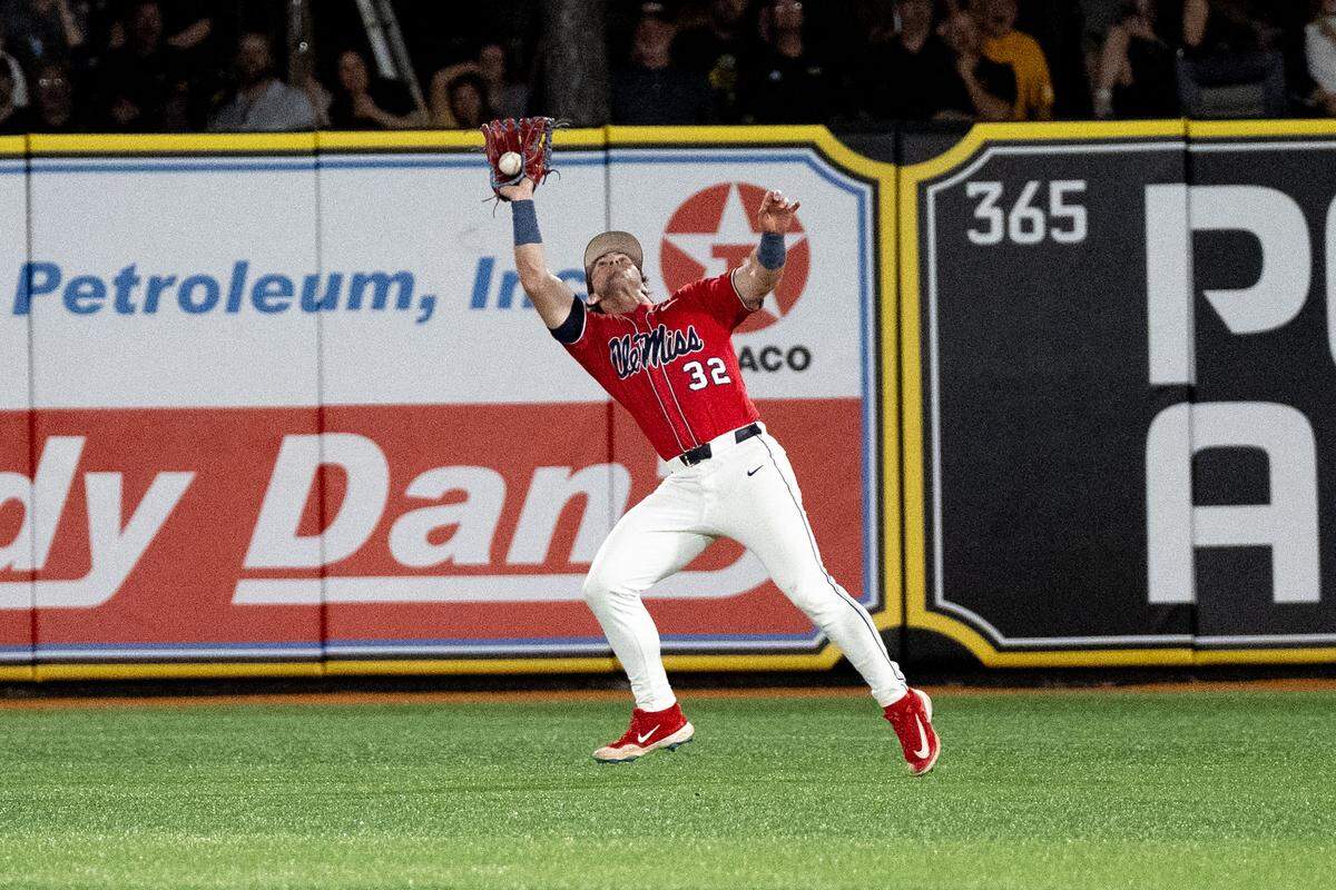 Ole Miss outfielder Tristan Bissetta (32) catches a ball in the outfield for an out during a baseball game at Pete Taylor Park in Hattiesburg on Tuesday, March 10, 2026.