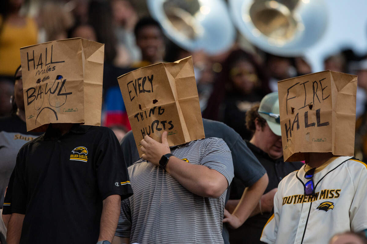 Southern Miss fans wear bags on their heads calling for Coach Will Hall’s firing during game between Southern Miss and Arkansas State at M.M. Roberts Stadium in Hattiesburg on Saturday, Oct. 19, 2024.