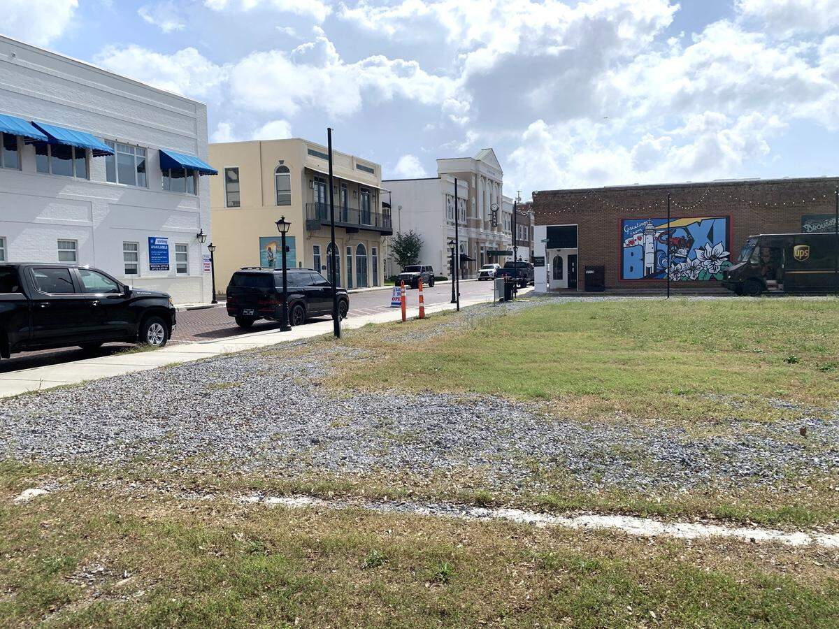 This empty lot in the center of downtown Biloxi is the site of Austin Square, a new attractions with French Quarter architecture surrounding a lively courtyard, shops and bar.