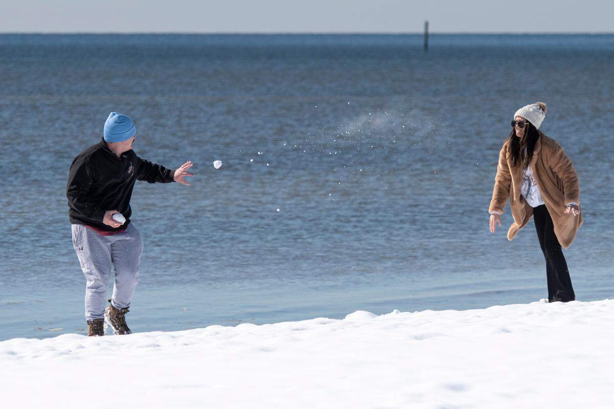 Andrew and Hannah Elliott enjoyed one of the rarest experiences in Biloxi on Wednesday, Jan. 22, 2025: A snowball fight on the beach.