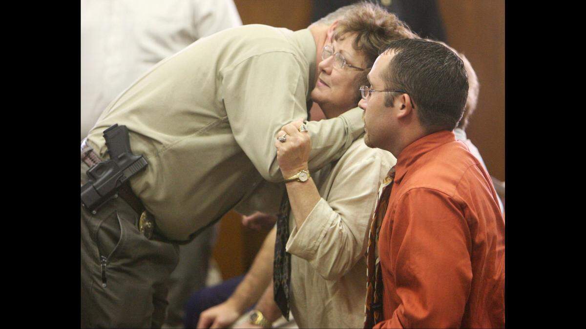 Pascagoula Police Sgt. Jeff Barnes hugs Debbie Eddins after Alexander Lett pleaded guilty to murder in the February 2005 shootings of Eddins’ husband, Donald Ray Eddins, at Northrop Grumman Ingall’s Shipbuilding in Pascagoula. Barnes was the lead investigator in the case.