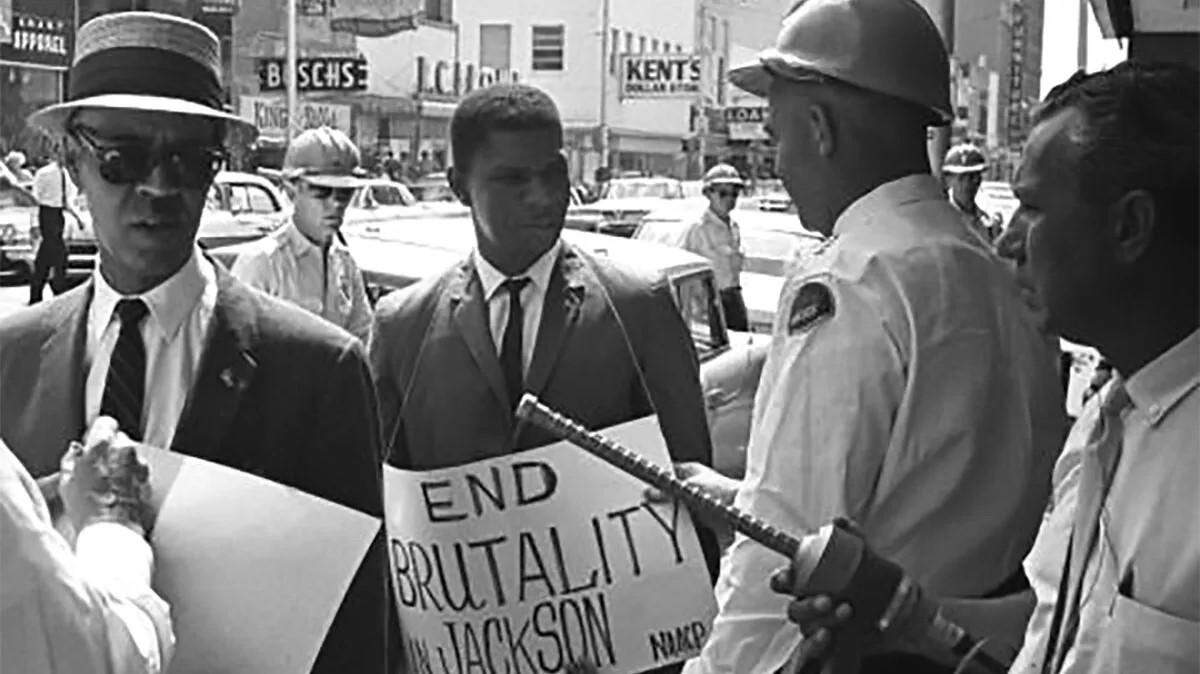 Roy Wilkins, left, and Medgar Evers, protest outside department stores in downtown Jackson.