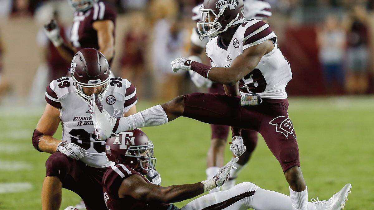 BOB LEVEY/ASSOCIATED PRESS 
 Mississippi State defensive back Taveze Calhoun (23) celebrates after tackling Texas A&M wide receiver Ricky Seals-Jones (9) as linebacker Richie Brown (39) looks on last week in College Station, Texas.