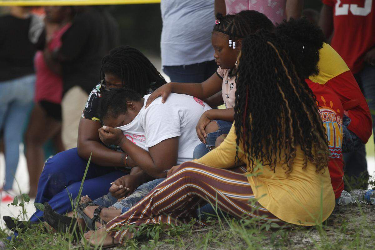 Families mourn as three teen’s bodies are recovered from the Biloxi River after after drowning in Dedeaux Park. Officials said the boys were swimming before they went under, according to witnesses.