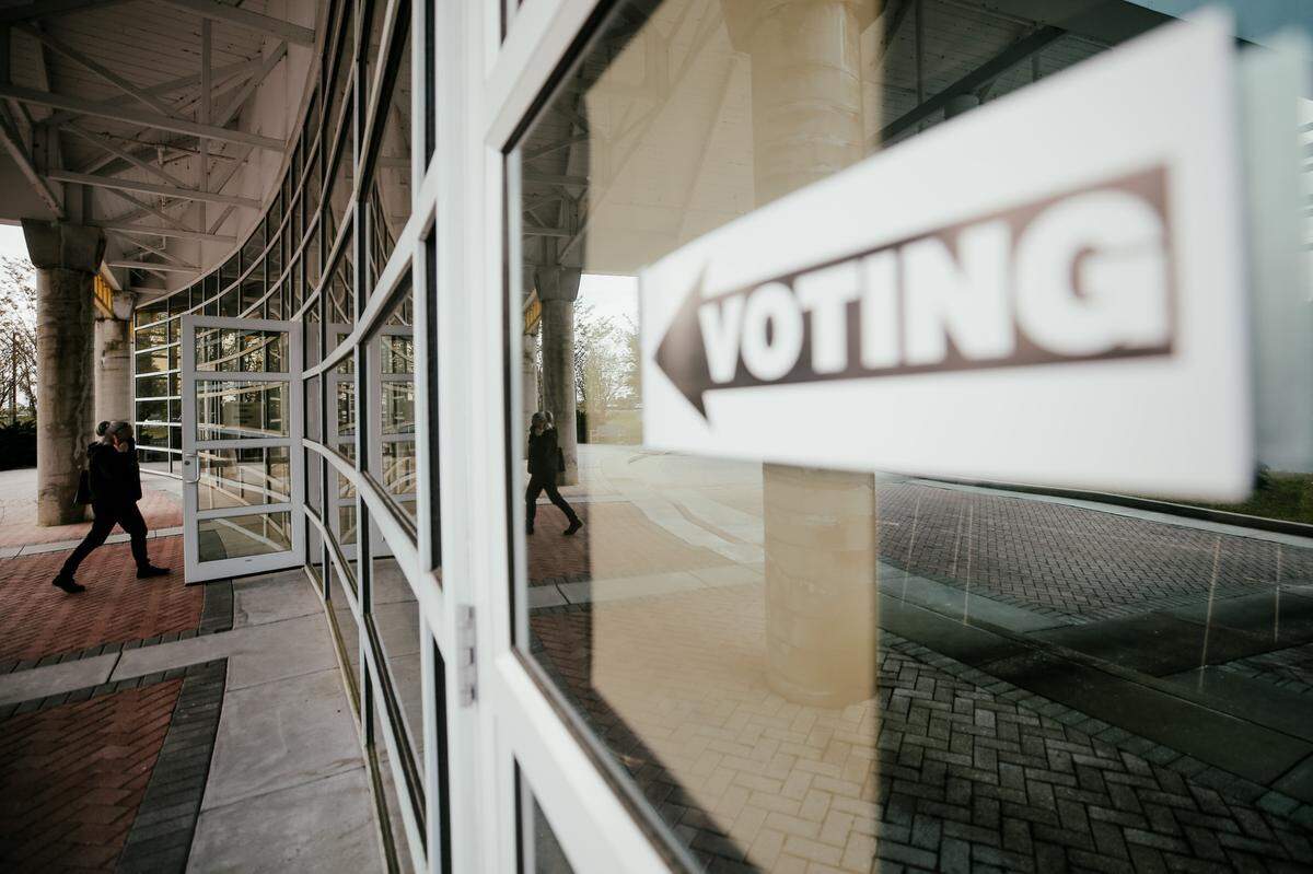 A masked voter walks into Moss Point’s Pelican Landing Event and Conference Center to cast their vote in the Tuesday, April 6, 2021, municipal primary election.
