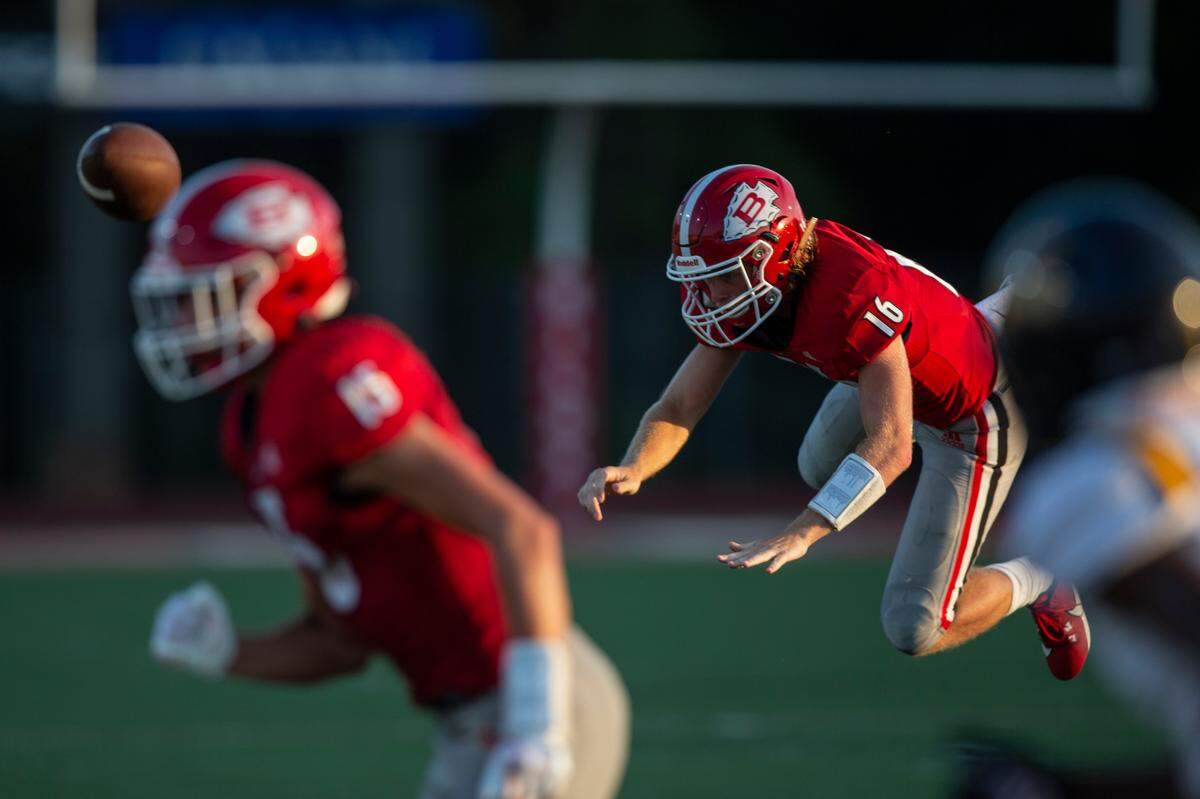 Biloxi quarterback Zachary Marlin gets tackled during a Jamboree game at Biloxi High School on Friday, Aug. 18, 2023.