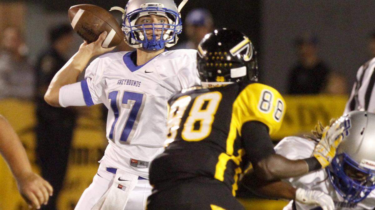 TIM ISBELL/SUN HERALD 
 Ocean Springs quarterback Drew Windham has led the Greyhounds on a seven-game winning streak. Tuesday, they appeared in the Associated Press' state-wide poll at No. 10.