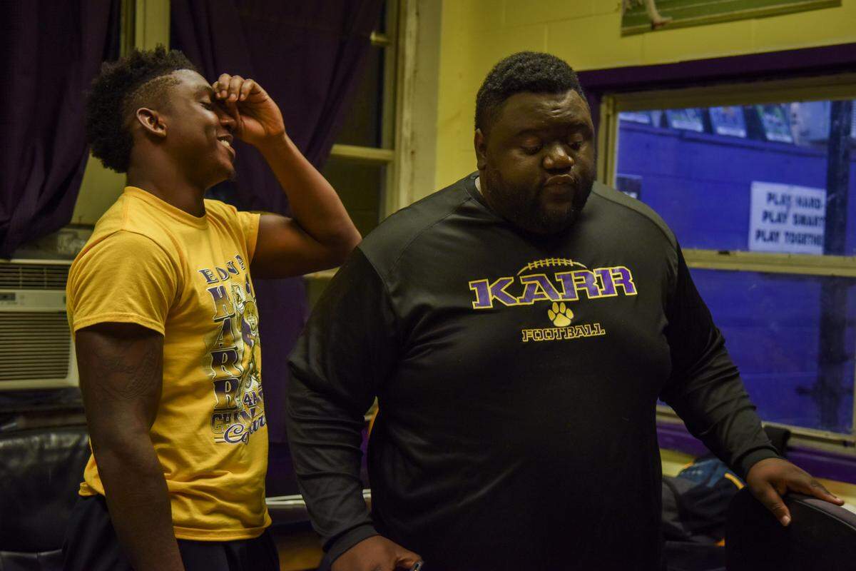 Ronnie Jackson reacts to a critique of his leadership skills by Edna Karr coach Brice Brown.