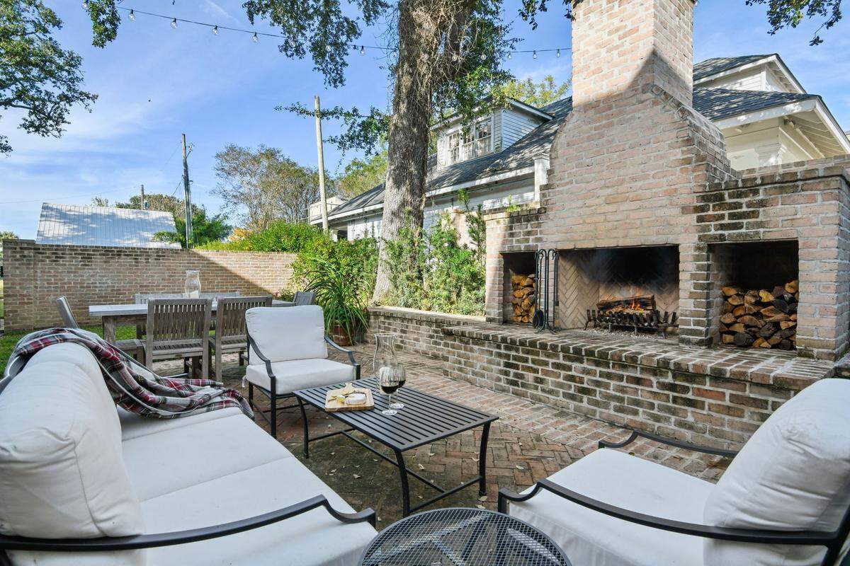 The current owners of this Pass Christian mansion have worked on many home improvements and projects, including this outdoor entertaining area with a large fireplace.