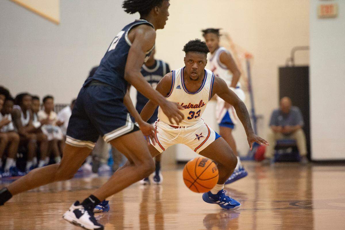 Gulfport’s Javier Simmons, right, faces down with Moss Point’s Kedrick Osby, left, during the Adidas Holiday Classic at Gulfport High School in Gulfport on Tuesday, Dec. 28, 2021.