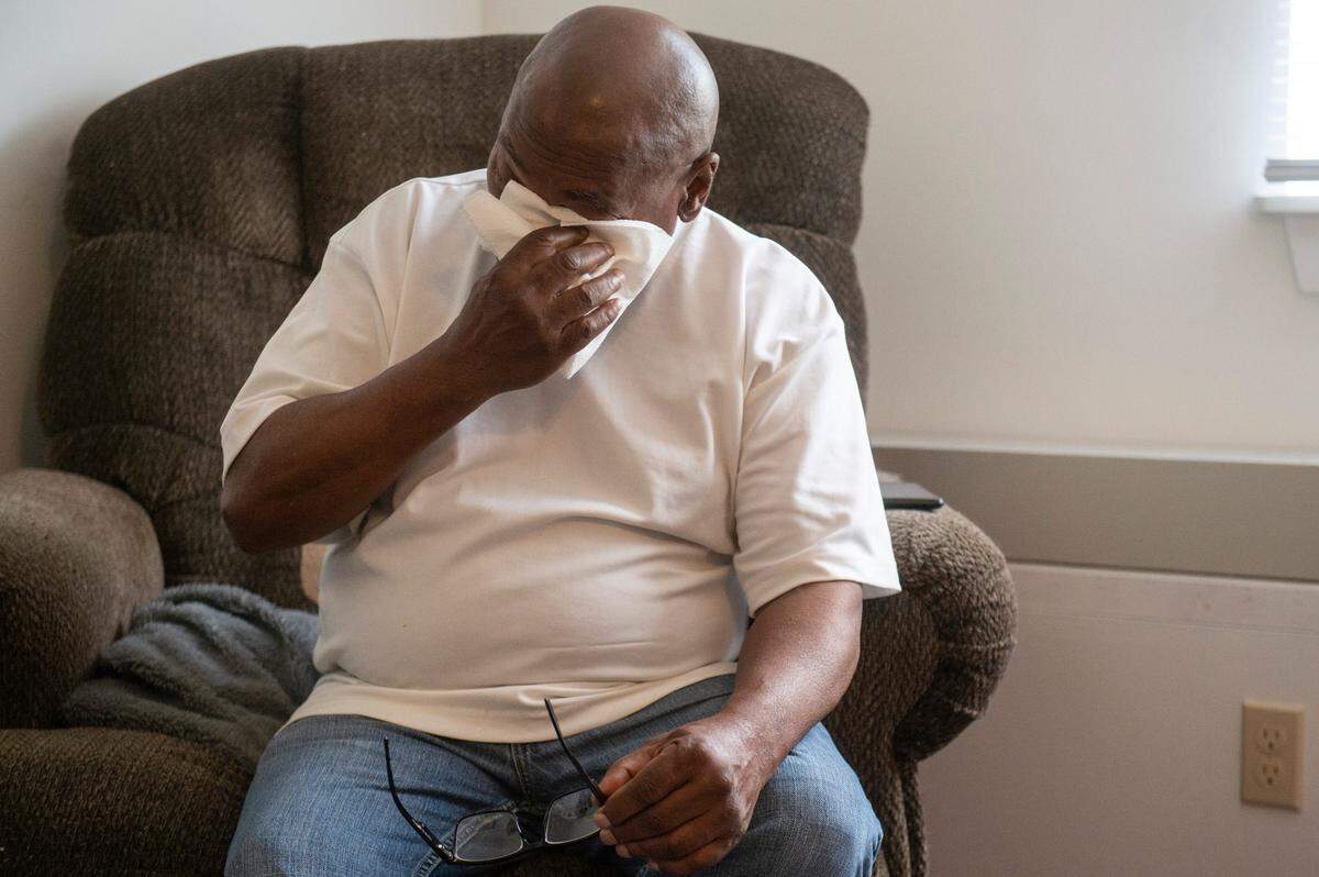 Clifton Williams tears up as he describes his experience getting out of homelessness during an interview at his apartment in Gulfport on Friday, April 11, 2025. Through the help of Open Doors Homeless Coalition, he has been off the streets for a year.
