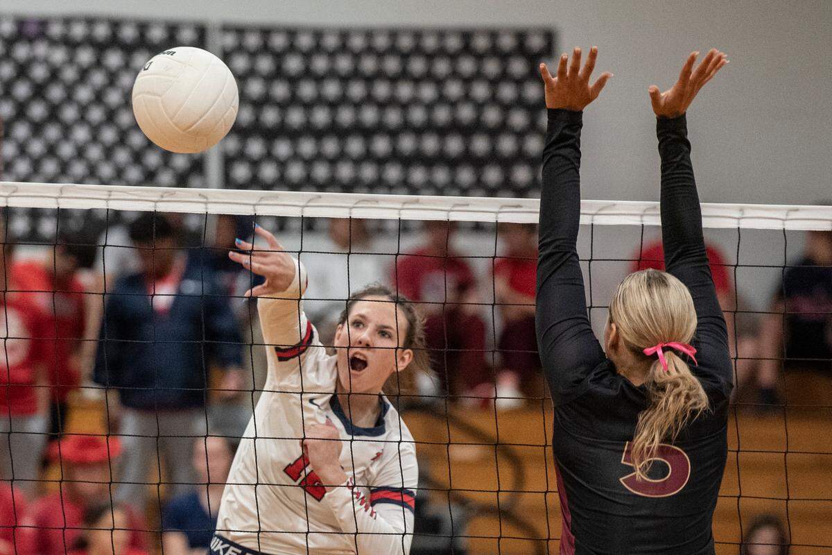 Hancock’s Anslee James spikes the ball over the net during the 6A South State Championship game at Hancock High School in Kiln on Monday, Oct. 16, 2023.