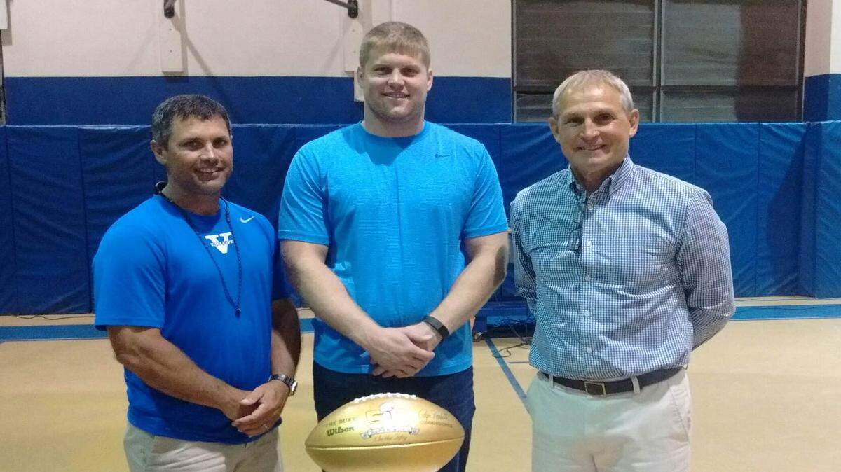 VETO ROLEY/SPECIAL TO THE SUN HERALDNew England Patriots linebacker Chris White, center, stands along a pair of his former coaches at Vancleave. Current Vancleave coach Lavon Capers, left, and former Vancleave coach Jim Bloomfield, right, both coached White in high school. Bloomfield is now the head coach at St. Patrick.