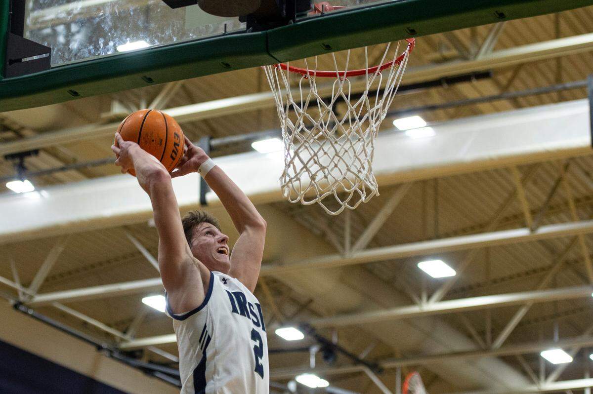 St. Patrick guard Nick Krass goes for a dunk during a game against Perry Central at St. Patrick Catholic High School on Thursday, Jan. 13, 2022.