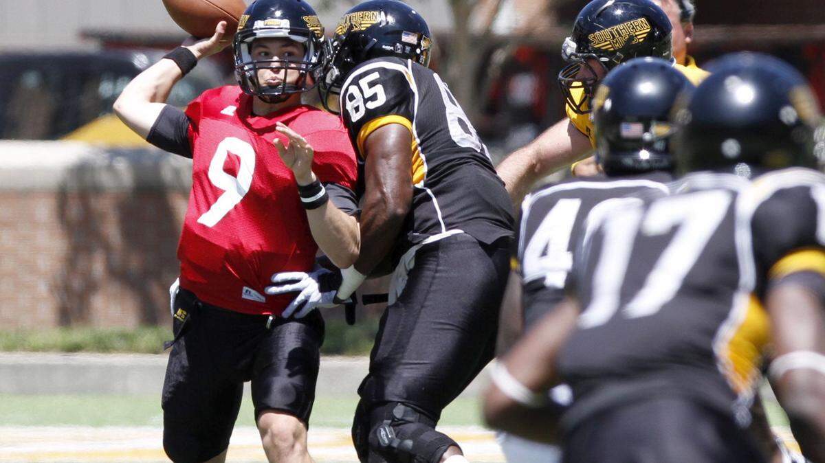 TIM ISBELL/SUN HERALD 
 Nick Mullens fires a pass for a first down during Black and Gold game, Saturday, Apr. 23, 2016.