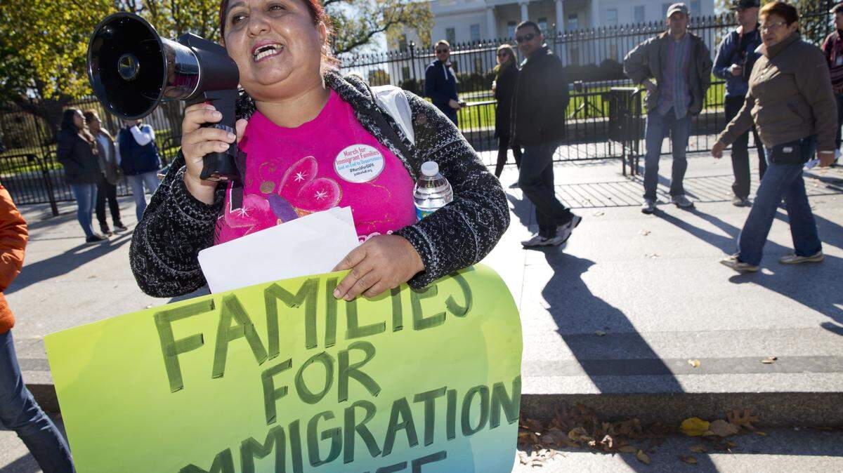 In this Nov. 20, 2015 file photo, Ingrid Vaca, originally of Bolivia speaks during rally for immigration reform in front of the White House in Washington. The Supreme Court has agreed to an election-year review of President Barack Obama's executive orders to allow up to 5 million immigrants to "come out of the shadows" and work legally in the U.S. (AP Photo/Jacquelyn Martin, File)